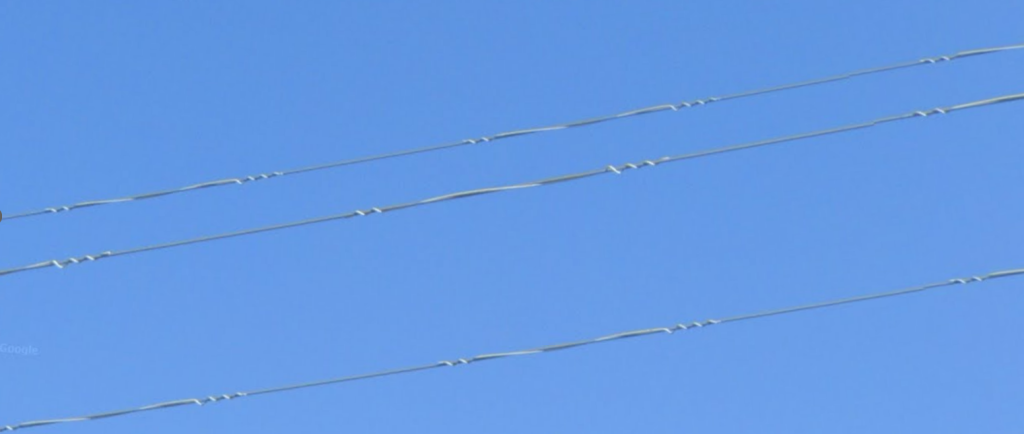 Description: Air flow spoilers on transmission lines.